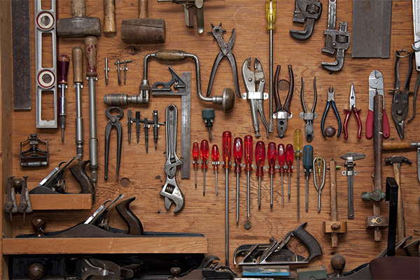 Tools hanging on a wall in a tool shed